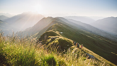 Couple hiking in the mountains of Saalbach Hinterglemm