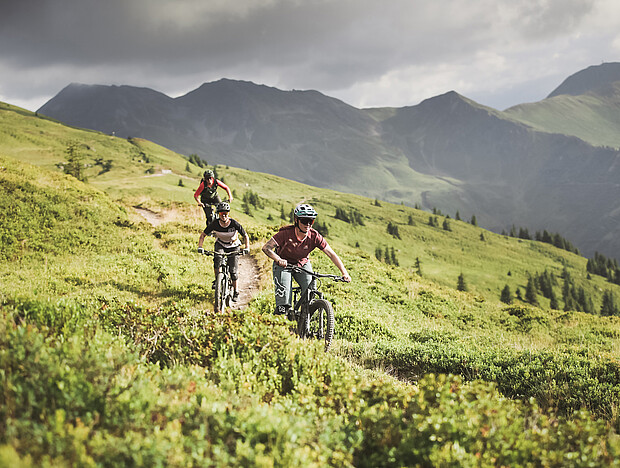 Three bikers on the Hacklberg trail in Saalbach Hinterglemm
