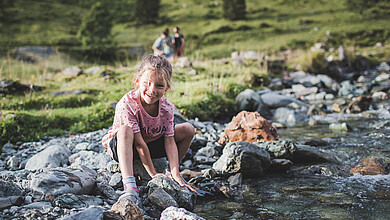 Girl at the riverbank, Saalbach Hinterglemm valley head
