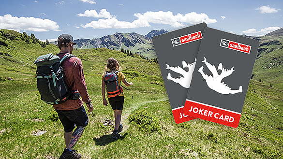 Paar beim Wandern in Saalbach Hinterglemm und Joker Card Grafiken