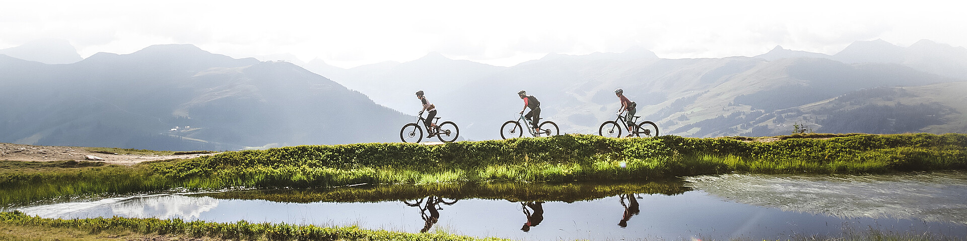Three bikers on the Hacklberg trail in Saalbach Hinterglemm
