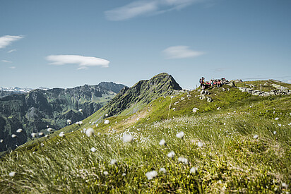 Group of hikers taking a break in the mountains of Saalbach Hinterglemm